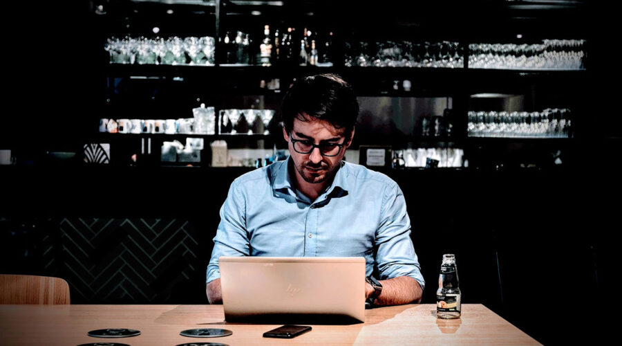 A student studies online to become a bartender